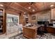 Spacious home office with custom wood finishes, built-in shelving, and elegant decor at 87 Biltmore Est, Phoenix, AZ 85016
