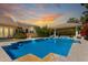 Stunning pool area with outdoor kitchen, gazebo, and lush greenery, perfect for relaxing at 87 Biltmore Est, Phoenix, AZ 85016