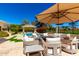Beautiful pool and patio area with comfortable seating, perfect for enjoying sunny days at 87 Biltmore Est, Phoenix, AZ 85016