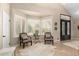 Cozy sitting area with shuttered windows, comfortable chairs, and a stylish rug, perfect for relaxation at 87 Biltmore Est, Phoenix, AZ 85016