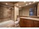 Bathroom features a combined tub and shower, with custom vanity at 8925 E Ann Way, Scottsdale, AZ 85260