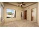 Bedroom with natural light, neutral carpet, and a ceiling fan at 8925 E Ann Way, Scottsdale, AZ 85260