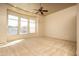 Bonus room features a ceiling fan and large windows, providing plenty of natural light at 8925 E Ann Way, Scottsdale, AZ 85260