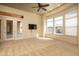 Bonus room with tile porch access and large windows overlooking the backyard at 8925 E Ann Way, Scottsdale, AZ 85260