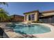 Gorgeous pool with baja shelf surrounded by lush landscaping at 8925 E Ann Way, Scottsdale, AZ 85260