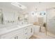 Bright bathroom showcasing double sinks, a soaking tub, a walk-in shower, and modern fixtures at 9052 N 29Th St, Phoenix, AZ 85028