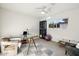 Bright home office with a glass desk, a comfortable chair, and a modern bookcase at 9052 N 29Th St, Phoenix, AZ 85028