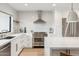 Modern kitchen featuring white cabinetry, stainless steel appliances, and a subway tile backsplash at 9052 N 29Th St, Phoenix, AZ 85028