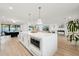 Spacious kitchen island with pendant lighting, sleek cabinets, and stainless steel microwave, offering a modern cooking space at 9052 N 29Th St, Phoenix, AZ 85028