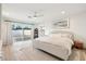 Spacious main bedroom with a king-size bed, sliding glass doors to the backyard, and modern decor at 9052 N 29Th St, Phoenix, AZ 85028