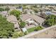 Well-manicured backyard with artificial turf, brick pavers, and lush landscaping at 927 W Azalea Pl, Chandler, AZ 85248