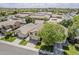 Property featuring a meticulously maintained exterior, with mature trees, and a green lawn at 927 W Azalea Pl, Chandler, AZ 85248