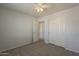 Bedroom featuring a ceiling fan, closet, and neutral carpet at 927 W Azalea Pl, Chandler, AZ 85248
