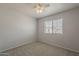 Neutral bedroom with a ceiling fan and window for natural light at 927 W Azalea Pl, Chandler, AZ 85248