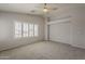 Bright bedroom with neutral walls, plush carpeting and plantation shutters at 927 W Azalea Pl, Chandler, AZ 85248