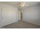 Bedroom with a ceiling fan and closet, perfect for relaxing at 927 W Azalea Pl, Chandler, AZ 85248