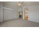 Large bedroom with neutral walls, plush carpeting and attached bathroom and kitchen at 927 W Azalea Pl, Chandler, AZ 85248