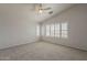 Inviting bedroom boasts vaulted ceilings, natural light from the shuttered windows and neutral carpeting at 927 W Azalea Pl, Chandler, AZ 85248