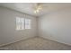 Comfortable bedroom with a ceiling fan and window at 927 W Azalea Pl, Chandler, AZ 85248