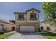 Two-story home with a well-maintained lawn and a two-car garage at 927 W Azalea Pl, Chandler, AZ 85248