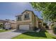 Charming two-story home with manicured lawn and an arched entryway at 927 W Azalea Pl, Chandler, AZ 85248