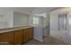 Hallway featuring carpeted floors, neutral paint, and storage cabinets at 927 W Azalea Pl, Chandler, AZ 85248