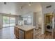 Large kitchen with island and dishwasher overlooks the living area and backyard at 927 W Azalea Pl, Chandler, AZ 85248