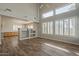 Bright living room with hardwood floors, tall windows, and open-concept layout at 927 W Azalea Pl, Chandler, AZ 85248