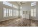 Bright living room features multiple windows and custom built-in shelving unit at 927 W Azalea Pl, Chandler, AZ 85248