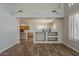 Open-concept living room showcases the seamless flow into the kitchen and dining area at 927 W Azalea Pl, Chandler, AZ 85248