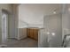 This spacious loft features convenient built-in storage and soft, neutral carpeting at 927 W Azalea Pl, Chandler, AZ 85248