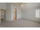 Expansive main bedroom with ensuite bathroom, featuring plush carpeting and neutral walls at 927 W Azalea Pl, Chandler, AZ 85248