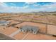 Expansive desert landscape and views in the distance enhance this single-story home's curb appeal at 9430 W Sandstone Mountain Dr, Casa Grande, AZ 85194