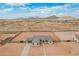 Single-story home featuring desert landscaping and beautiful mountain views in the surrounding area at 9430 W Sandstone Mountain Dr, Casa Grande, AZ 85194