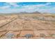 Community aerial shot with mountain views and surrounding desert landscape at 9430 W Sandstone Mountain Dr, Casa Grande, AZ 85194