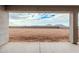 Backyard view showcasing a large, undeveloped yard with block wall, offering potential for customization and landscaping at 9430 W Sandstone Mountain Dr, Casa Grande, AZ 85194