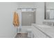 Bright bathroom featuring a shower-tub combo and a modern single sink vanity, providing both style and functionality at 9430 W Sandstone Mountain Dr, Casa Grande, AZ 85194