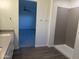 Modern bathroom highlighting a step-in shower and dual access to another room at 9430 W Sandstone Mountain Dr, Casa Grande, AZ 85194