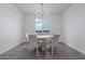 Bright dining room featuring stylish modern table and neutral color palette and outside view at 9430 W Sandstone Mountain Dr, Casa Grande, AZ 85194
