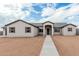 Beautiful single-story home featuring a desert landscape and walkway to the front entrance at 9430 W Sandstone Mountain Dr, Casa Grande, AZ 85194