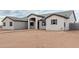 Single-story home showcasing desert landscape and walkway leading up to the arched front entrance at 9430 W Sandstone Mountain Dr, Casa Grande, AZ 85194
