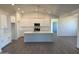 Bright, open kitchen featuring a large island, modern appliances, and stylish white cabinets at 9430 W Sandstone Mountain Dr, Casa Grande, AZ 85194