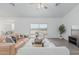Open living room featuring neutral decor, hard surface flooring, and lots of natural light at 9430 W Sandstone Mountain Dr, Casa Grande, AZ 85194