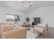 Bright living room featuring stylish modern furniture and neutral color palette with sliding door to outdoor space at 9430 W Sandstone Mountain Dr, Casa Grande, AZ 85194