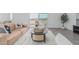 Comfortable living area with a warm color palette, hard surface floors, and plenty of seating at 9430 W Sandstone Mountain Dr, Casa Grande, AZ 85194