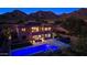Aerial view of the backyard featuring a pool, outdoor seating, and well-manicured landscaping at 10843 E Acacia Dr, Scottsdale, AZ 85255