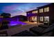 Relaxing backyard with a modern spa and lounge seating, perfect for evening entertaining and enjoyment at 10843 E Acacia Dr, Scottsdale, AZ 85255