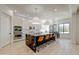 Modern kitchen featuring a large island with seating, double ovens, and pendant lighting at 10843 E Acacia Dr, Scottsdale, AZ 85255