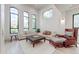 Bright living room with high ceilings, oversized windows, and comfortable seating at 10843 E Acacia Dr, Scottsdale, AZ 85255