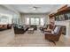Open-concept living room flowing into the kitchen with a view of the pool and outdoor area at 10843 E Acacia Dr, Scottsdale, AZ 85255